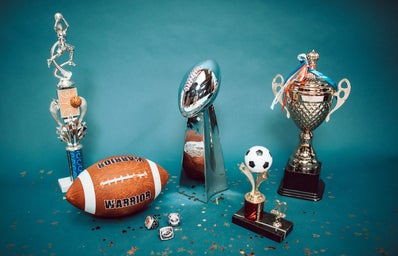 A football and football trophies.