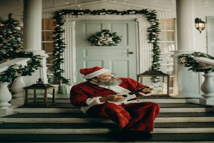 santa claus on decorated porch by cottonbro?width=698&height=466&fit=crop&auto=webp