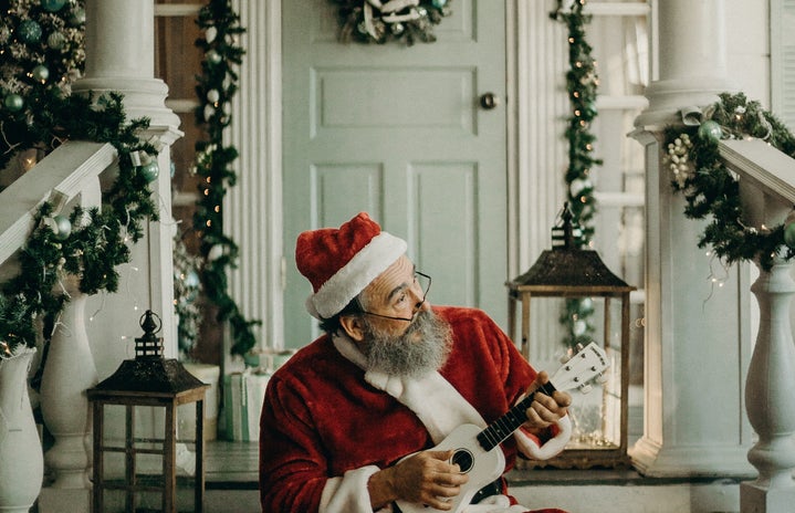 santa claus on decorated porch by cottonbro?width=719&height=464&fit=crop&auto=webp