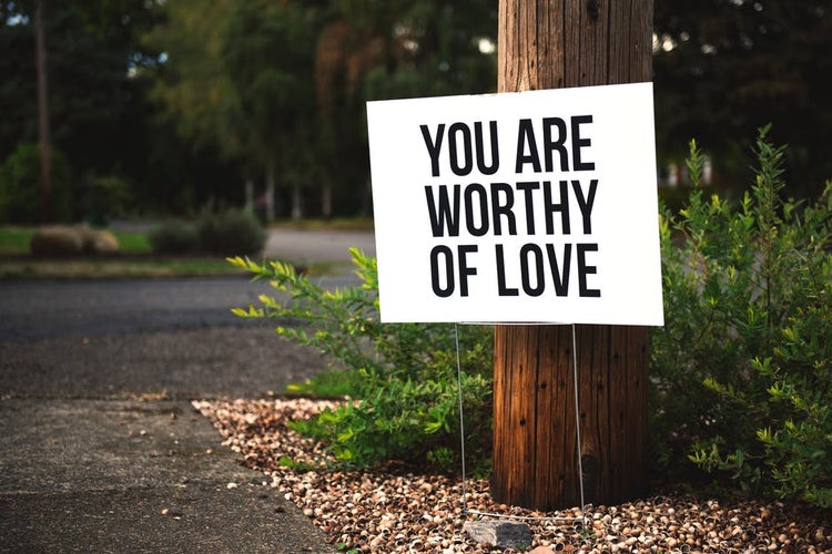 Sign that reads “you are worthy of love”