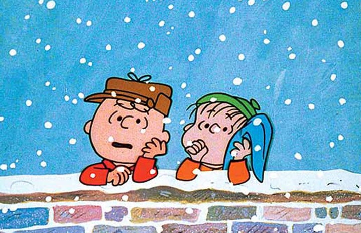 Two characters from Charlie Brown leaning against a wall.
