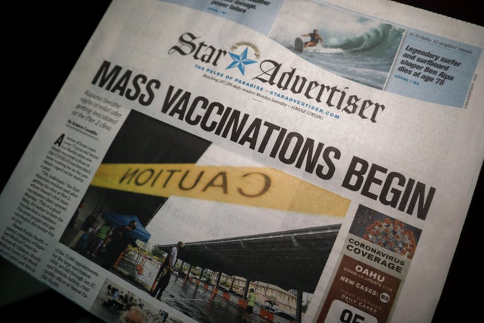 Newspaper with Vaccine distribution title by little plant on Unsplash?width=698&height=466&fit=crop&auto=webp