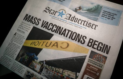 Newspaper with Vaccine distribution title