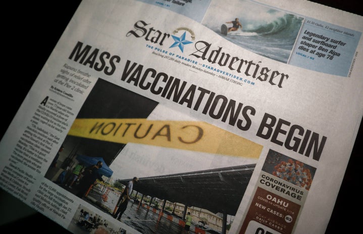 Newspaper with Vaccine distribution title by little plant on Unsplash?width=719&height=464&fit=crop&auto=webp