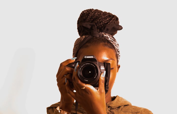woman using a camera