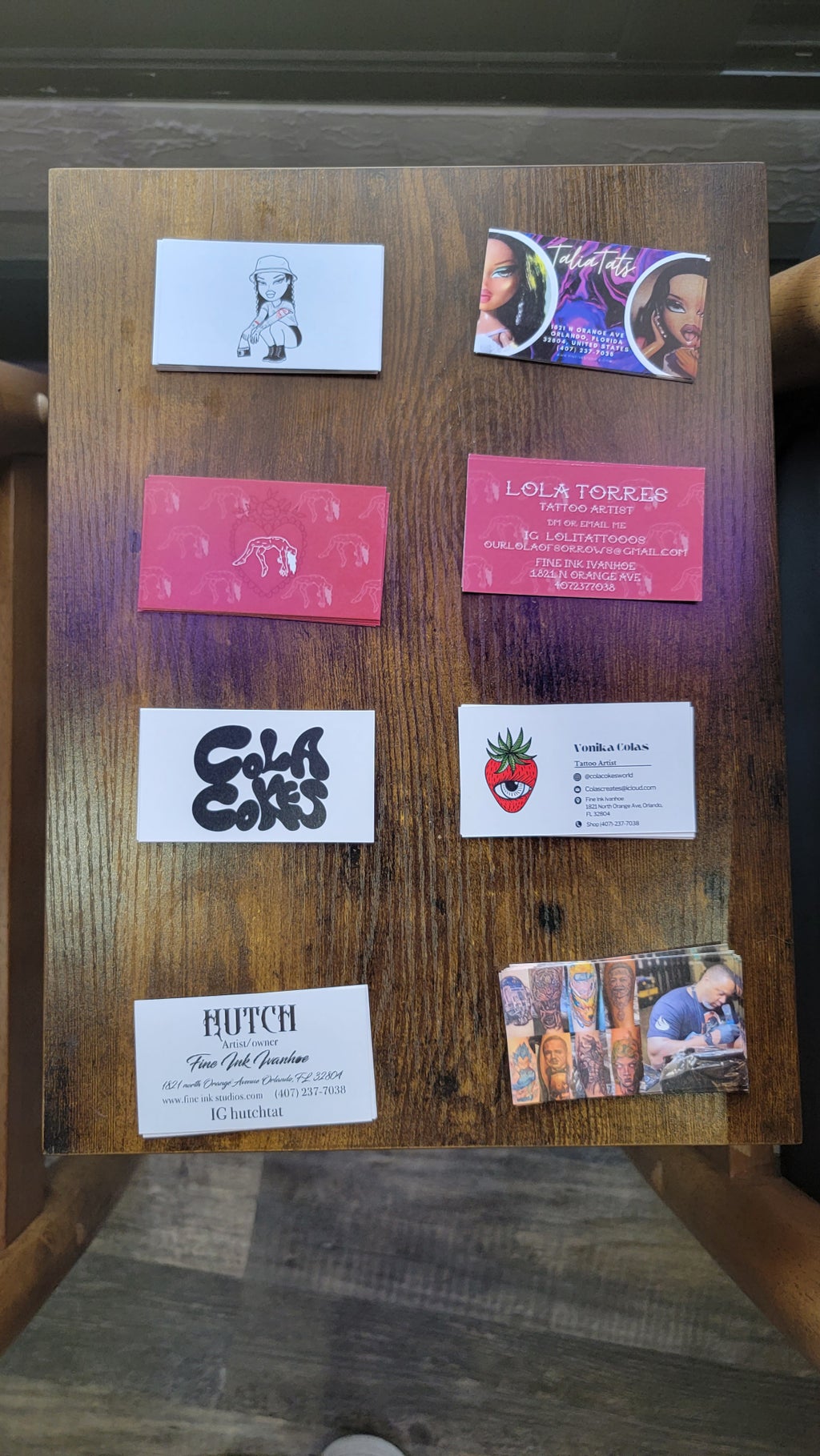 Business cards of all the artists mentioned