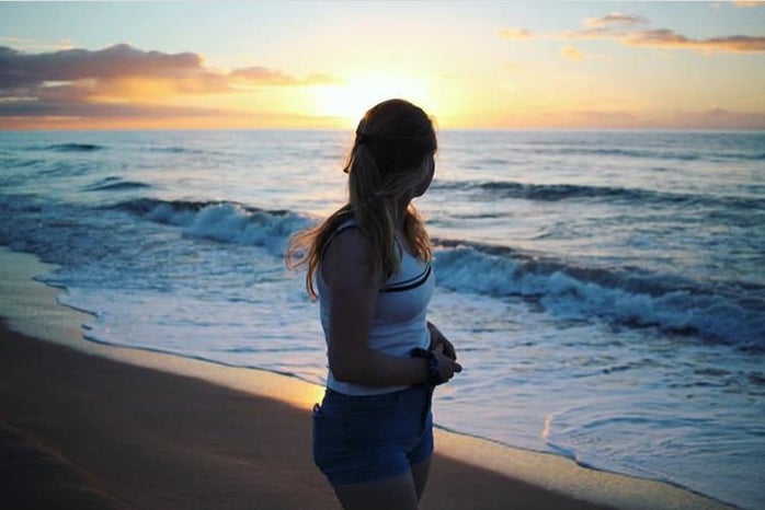 charlotte reader sunset beach girl ocean water sky nature peaceful?width=698&height=466&fit=crop&auto=webp