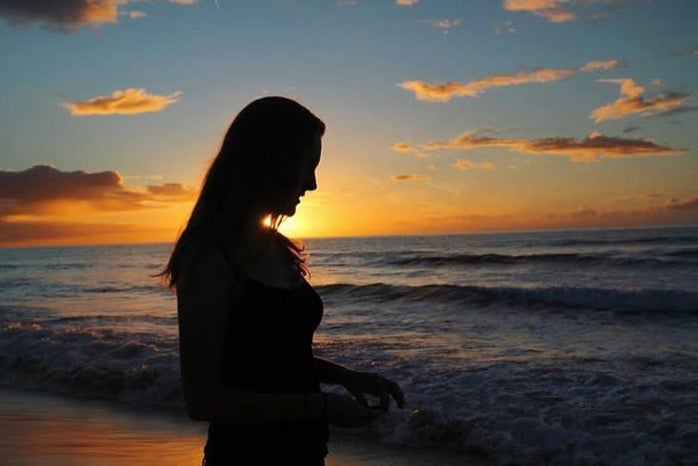 charlotte reader sunset ocean beach sky evening?width=698&height=466&fit=crop&auto=webp