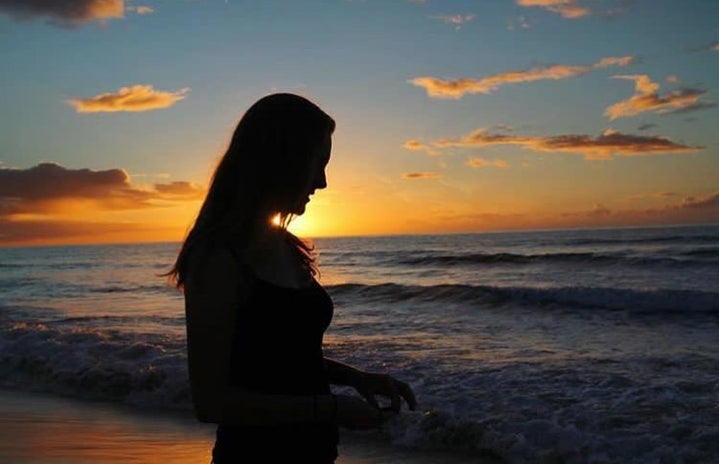 charlotte reader sunset ocean beach sky evening?width=719&height=464&fit=crop&auto=webp