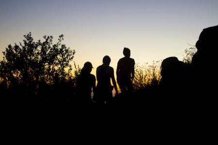 friends girls hike sunset mountains adventure silhouette