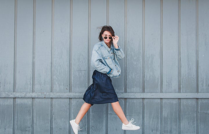 girl with jean jacket and skirt jumping 1
