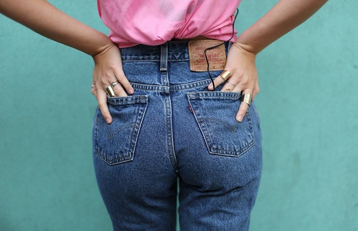 pink shirt jeans butt back pockets levis teal wall