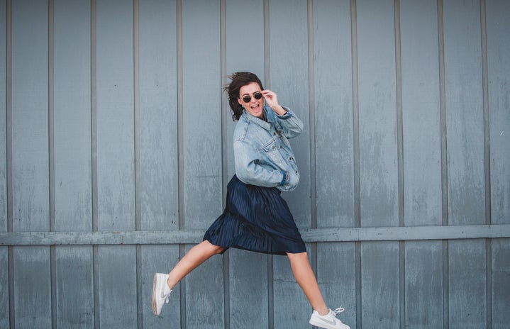 girl with jean jacket and skirt jumping 2