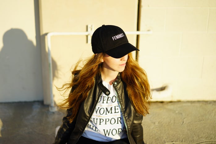 Laura Claypool feminist black baseball cap leather jacket girl?width=698&height=466&fit=crop&auto=webp