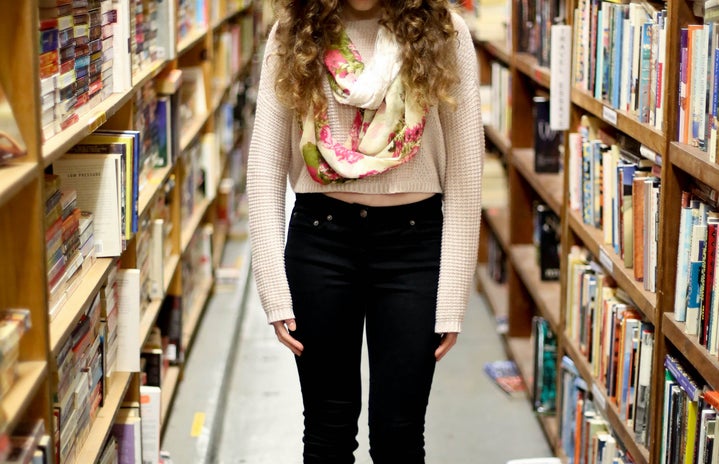 Girl In Library By Books