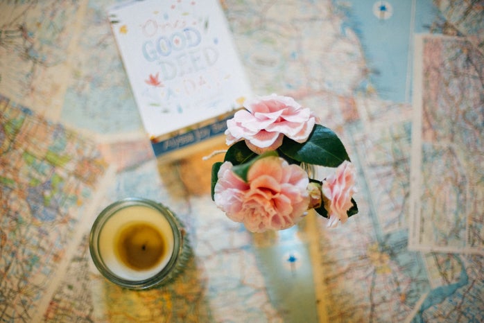 Candle And Flowers On Maps