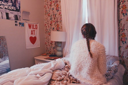 Anna Schultz-Girl Sitting On Bed Facing Wall