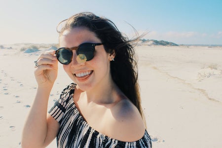 Anna Schultz-Happy Girl In Sunglasses On Beach