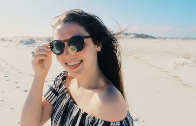 Anna Schultz-Happy Girl In Sunglasses On Beach