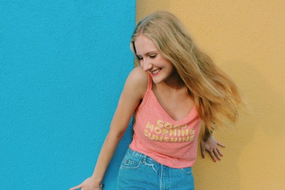 Anna Schultz girl laughing good morning sunshine yellow and blue wall?width=698&height=466&fit=crop&auto=webp