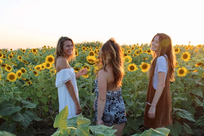 Maria Scheller laughing friends silly fun sunflower summer dress happy?width=698&height=466&fit=crop&auto=webp