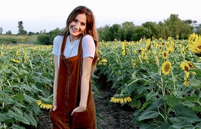 Maria Scheller-Brunette Happy Girl Sunflower Field Dress Hands In Pockets