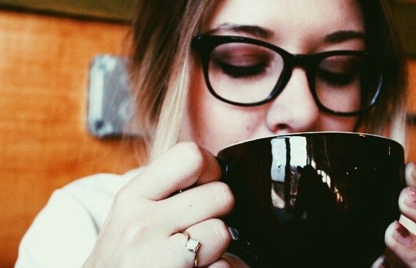 Amelia Kramer girl with glasses close up sipping latte coffee shop?width=719&height=464&fit=crop&auto=webp