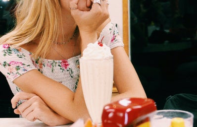 Anna Schultz-Girl Sitting At Diner With Milkshake Pondering