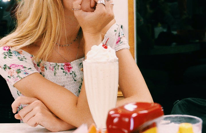 Anna Schultz girl sitting at diner with milkshake pondering?width=719&height=464&fit=crop&auto=webp