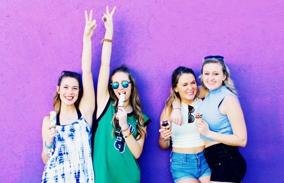 Amelia Kramer happy friends hrowing the peace sign and eating ice cream?width=719&height=464&fit=crop&auto=webp