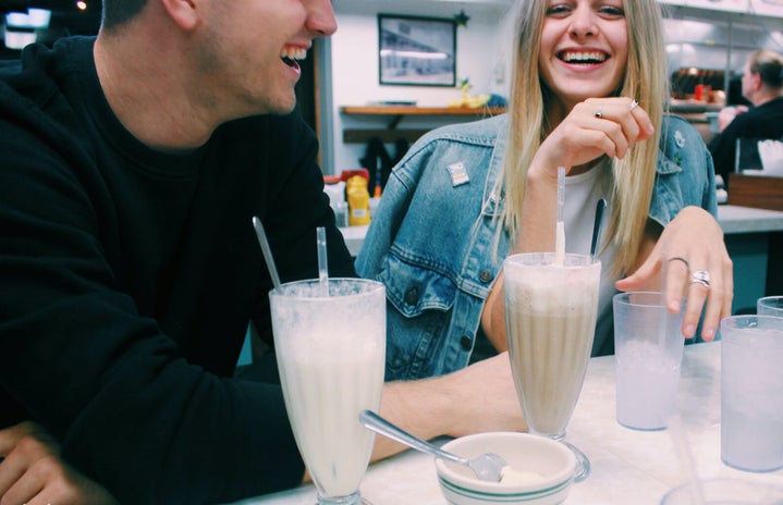 Anna Schultz girl and guy couple laughing with milkshakes?width=719&height=464&fit=crop&auto=webp