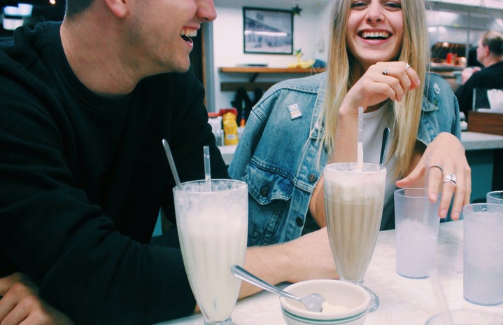 Anna Schultz-Girl And Guy Couple Laughing With Milkshakes