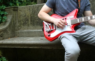 Guy Red Guitar Plants Outside Bench Summer