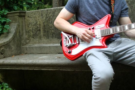 Guy Red Guitar Plants Outside Bench Summer