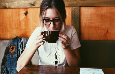 Amelia Kramer-Girl Wearing Glasses Sipping Coffee