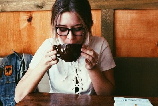 Amelia Kramer girl wearing glasses sipping coffee?width=698&height=466&fit=crop&auto=webp