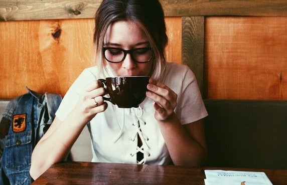 Amelia Kramer girl wearing glasses sipping coffee?width=719&height=464&fit=crop&auto=webp