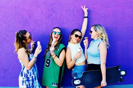 Amelia Kramer-Laughing Group Of Girls In Front Of Purple Mural