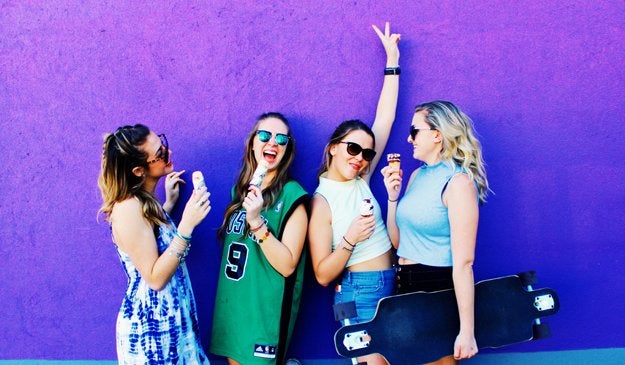 Amelia Kramer-Laughing Group Of Girls In Front Of Purple Mural