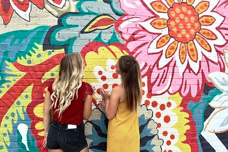 Maria Scheller-Two Girls Friends Long Hair Blonde And Burnette Flower Mural