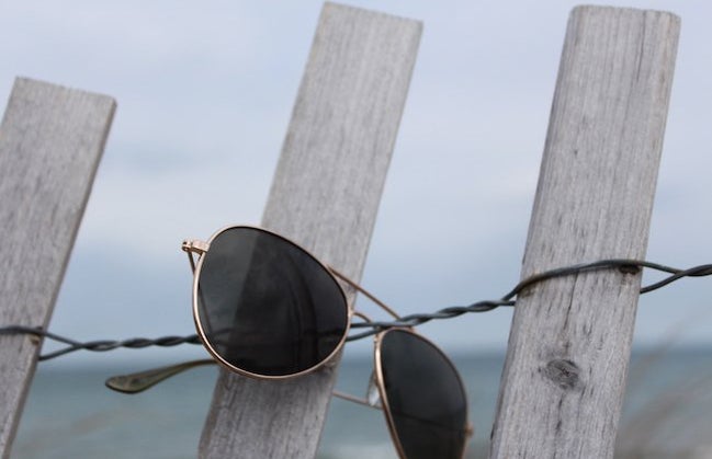 The Lalaaviator Glasses On A Fence