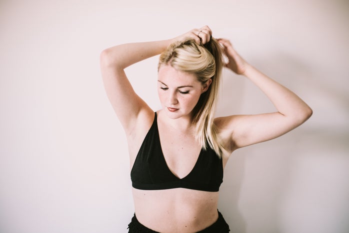 Arianna Tucker-Girl Putting Hair In Ponytail