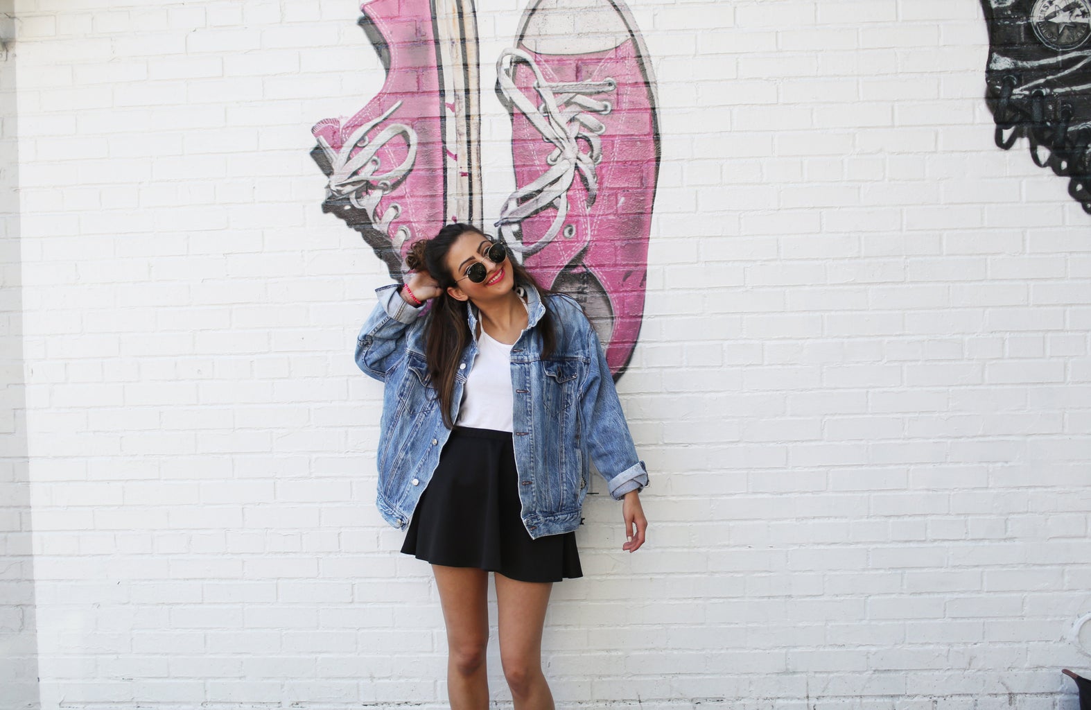 The Lalagirl In Jean Jacket In Front Of Mural