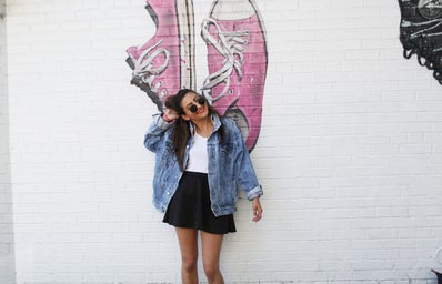The Lalagirl In Jean Jacket In Front Of Mural