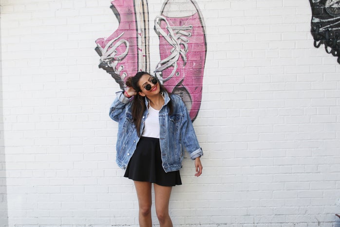 the lala girl in jean jacket in front of mural?width=698&height=466&fit=crop&auto=webp