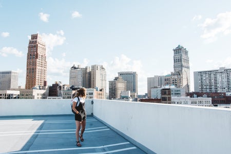 Cameron Smith-City Skyline Detroit Michigan Girl Overalls Street Buildings Skyscrapers 1