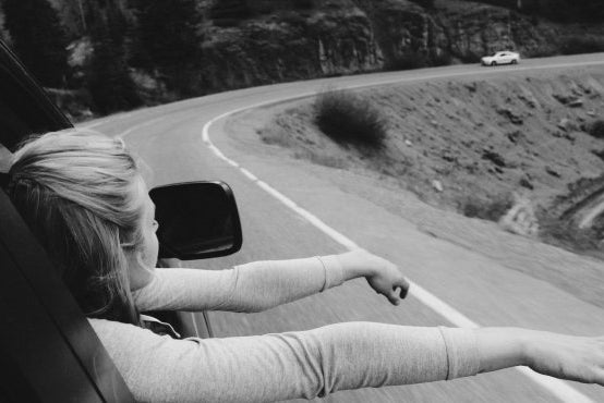 Anna Schultz girl on road trip hands out window bw?width=698&height=466&fit=crop&auto=webp