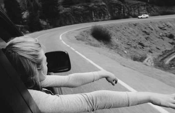 Anna Schultz girl on road trip hands out window bw?width=719&height=464&fit=crop&auto=webp