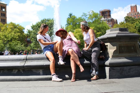 The Lalathree Girls Sitting By A Fountain