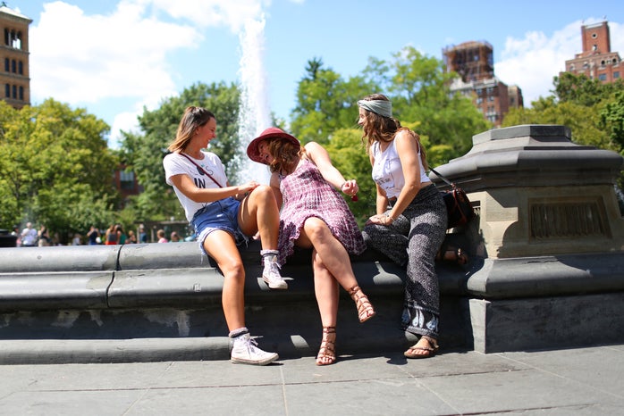 the lala three girls sitting by a fountain?width=698&height=466&fit=crop&auto=webp